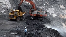 (FILES) In this photograph taken on July 27, 2007, Indian workers use heavy machinery to shift a pile of coal at an open cast mine owned by The Sinagareni Collieries Company Limited (SCCL) at Godavarikhani, some 250 kilometers east of Hyderabad.  Human Rights Watch has blasted the Indian government on June 14, 2012, for failing to regulate the country's 