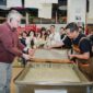 H.E. Mr. Karlis Eihenbaums，ambassador of Latvia to China, tries his hand at the traditional craft of Xuan papermaking.